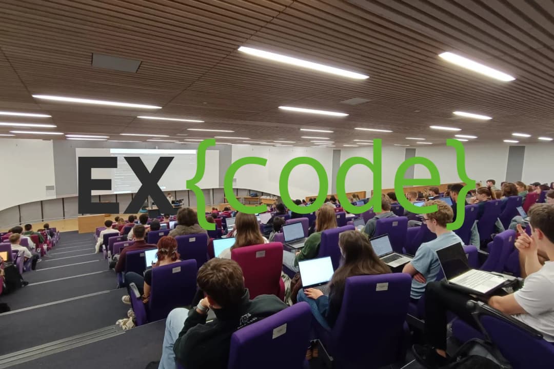 The Excode logo on top of an Exeter lecture theatre.